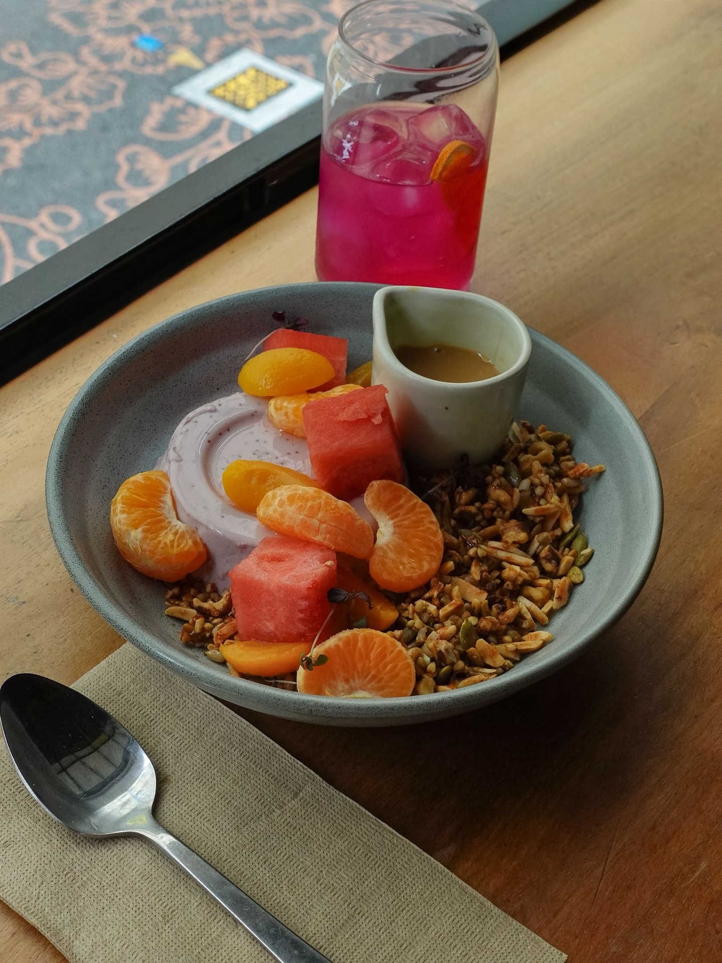 House granola bowl with seasonal fruit